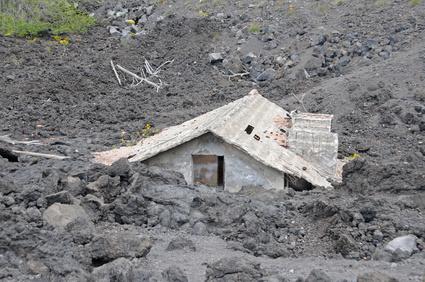 House buried under lava on the slopes of Mount Etna, Sicily, Italy