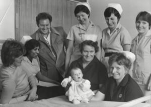 Louise Brown, the first 'Test Tube Baby' surrounded by her parents and nurses.
