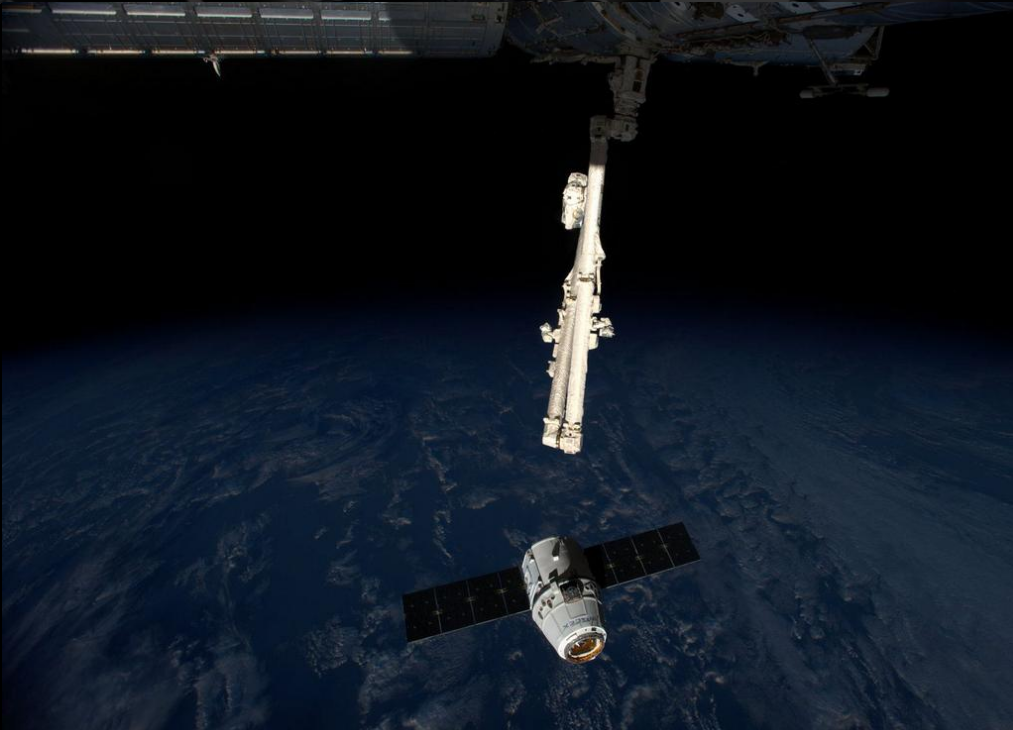 Image Just prior to Dragon docking at the ISS today: (Image thanks to Mike Chen, Made in Space)