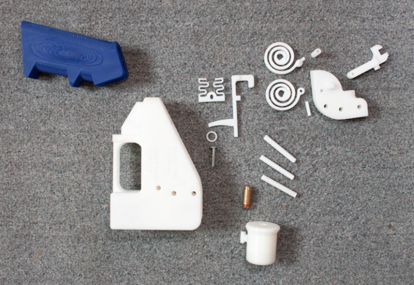 The sixteen pieces of Defense Distributed's printed handgun, including spiral springs for its hammer mechanism and a nail used as its firing pin. Click to enlarge. (Credit: Michael Thad Carter for Forbes)