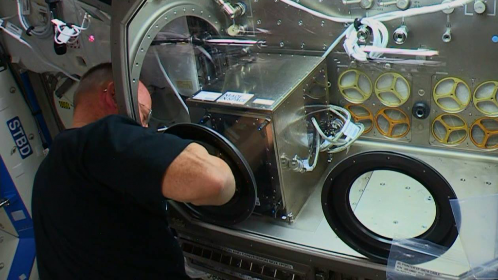 Butch operating 3D printer on ISS credit NASA