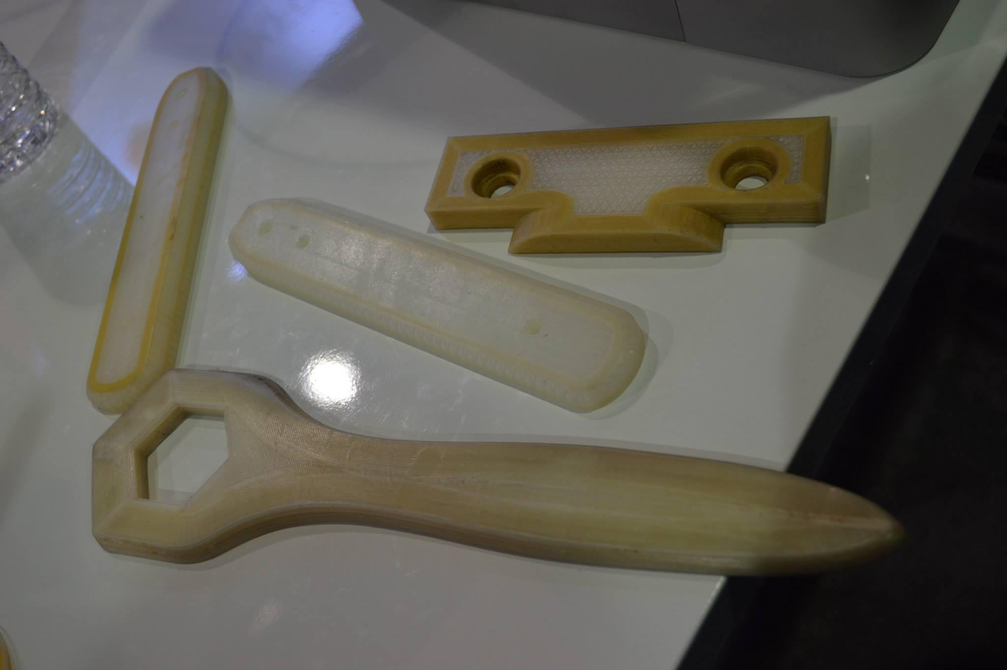 Parts 3D printed with fiberglass and Kevlar in them.