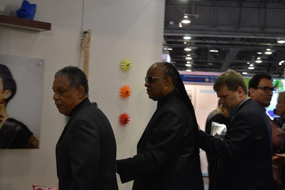 Stevie Wonder being escorted to the 3D Systems booth at CES (image by Eddie Krassenstein - 3DPrint.com)