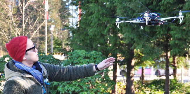 Mark Anthony Wijayak monitors a flight test of the Avian security drone.