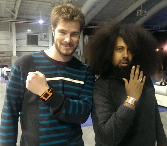Eric Migicovsky and his pal Reggie show off their Pebble smartwatches.