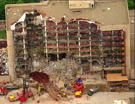 Work continues with heavy equipment to remove the rubble from inside the ruins of Alfred P. Murrah Building Tuesday May 2, 1995, in Oklahoma City which was the target of a terrorist attack on April 19.  (AP Photo/Eric Draper)