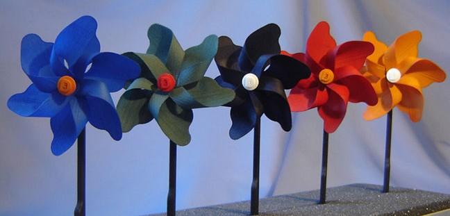 3D printed pinwheels after being treated with a post coloring process.