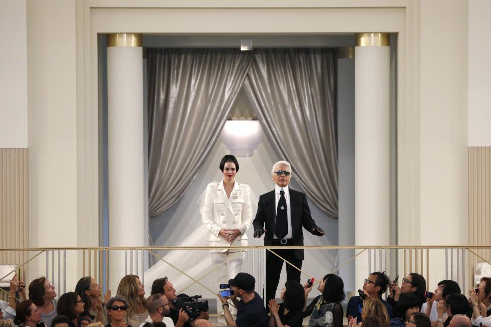 German designer Karl Lagerfeld appears with model Kendall Jenner at the end of his Haute Couture Fall Winter 2015/2016 fashion show for Chanel at the Grand Palais in Paris, France, July 7, 2015. REUTERS/Stephane Mahe