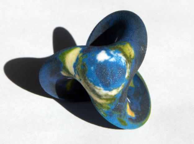 "Twisted Earth" is 3D printed in full color sandstone and costs $14.00 through Segerman's Shapeways store.