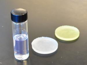 Light-curable resin material as a liquid, after curing and after exposure to UV light.