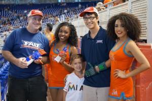 Weinthal and Coarsey with Julian at a Miami Marlins game. 