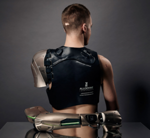 Sensors that operate the hand are attached to his back under the harness.