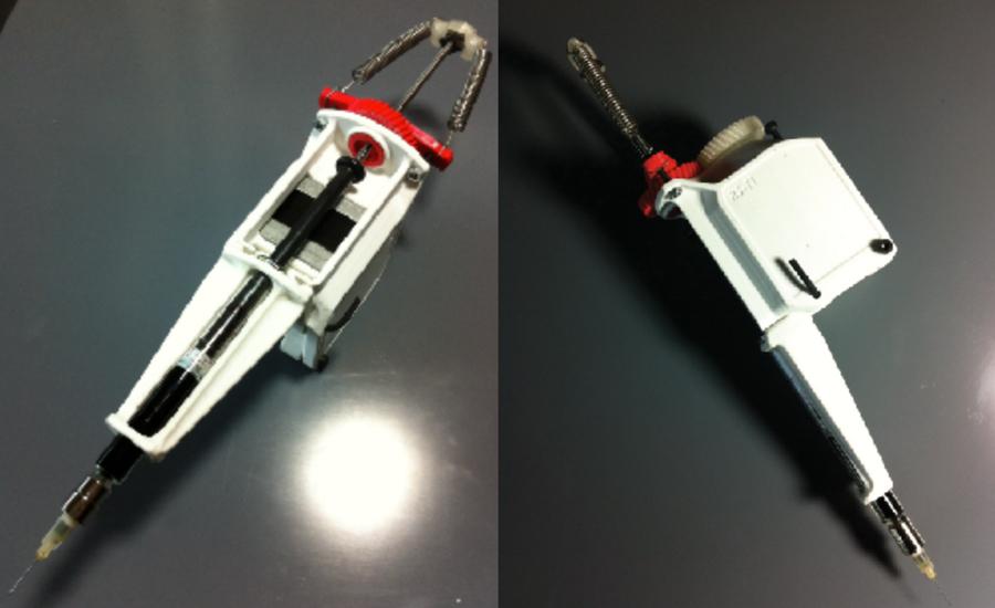 The 3D printed syringe pump extruder.