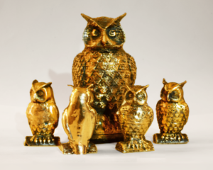 3D printed brass owls. 
