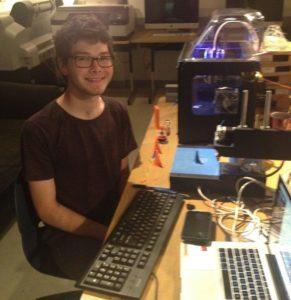 Art major Chase helps keep the 3D printers running during SAW 2016.