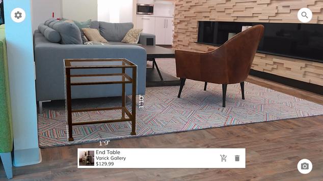 This May 2016 photo provided by Wayfair demonstrates the company’s augmented reality app, WayfairView, which allows shoppers to visualize furniture and decor in their homes at full-scale before they make a purchase. This image shows a screen grab taken with the app of an end table that has been selected to visualize in the space. (Wayfair via AP) MANDATORY CREDIT