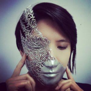 The artist, wearing one of her 3D printed masks.