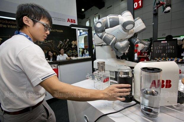 YuMi the barista robot from ABB Robotics made coffee for all the attendees at last month's Manufacturing Expo 2016 at Bitec Bang Na - and could begin replacing human workers at coffee shops and franchises... Please credit and share this article with others using this link:https://www.bangkokpost.com/news/general/1034329/technology-imperils-12-million-jobs. View our policies at https://goo.gl/9HgTd and https://goo.gl/ou6Ip. © Post Publishing PCL. All rights reserved.
