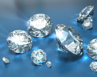 Diamonds on a blue background. 3D render with caustics, HDRI lighting and raytraced textures.