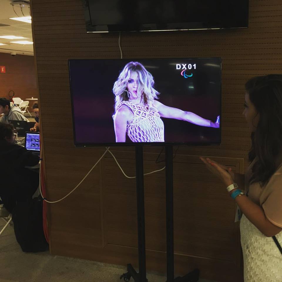 Danit watching Amy Purdy dancing in the 3D printed dress she created.