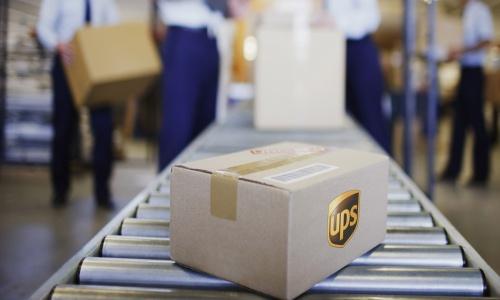 Cape Town, South Africa --- Box on conveyor belt in shipping area --- Image by Â© Ocean/Corbis