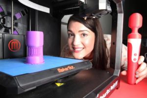 Christina watches on as the Sun Wand sex toy is printed on a 3D printer at the Lovehoney warehouse [Image: The Sun]