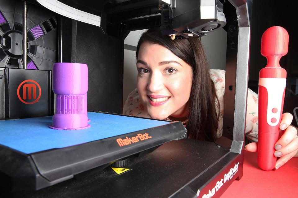 Christina watches on as the Sun Wand sex toy is printed on a 3D printer at ...