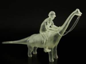 A man riding a dinosaur, courtesy of 3D printing. 