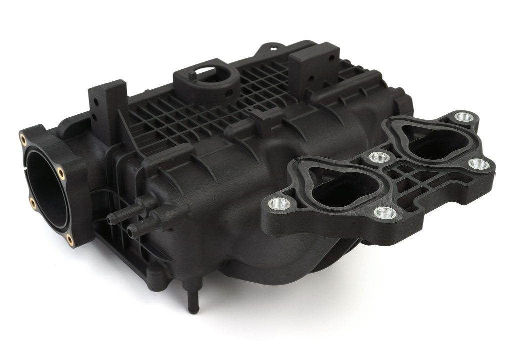 Car intake manifold in black Windform made using Powder bed fusion.
