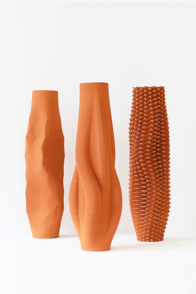 Functional Ceramics by Olivier van Herpt, image of three terracotta colored vases.