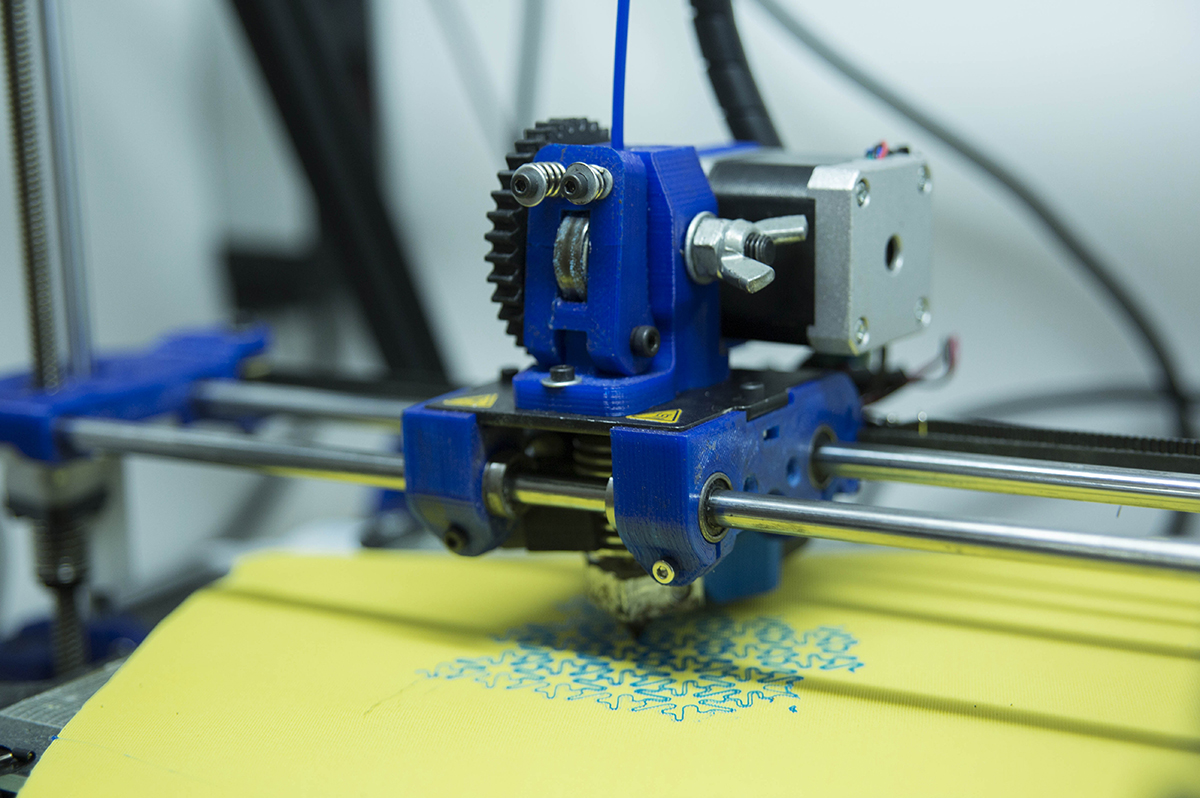 Picture of a 3D printer printing a sample