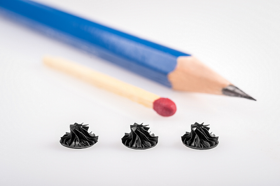 A nano industrial impeller compared to a pencil and match.