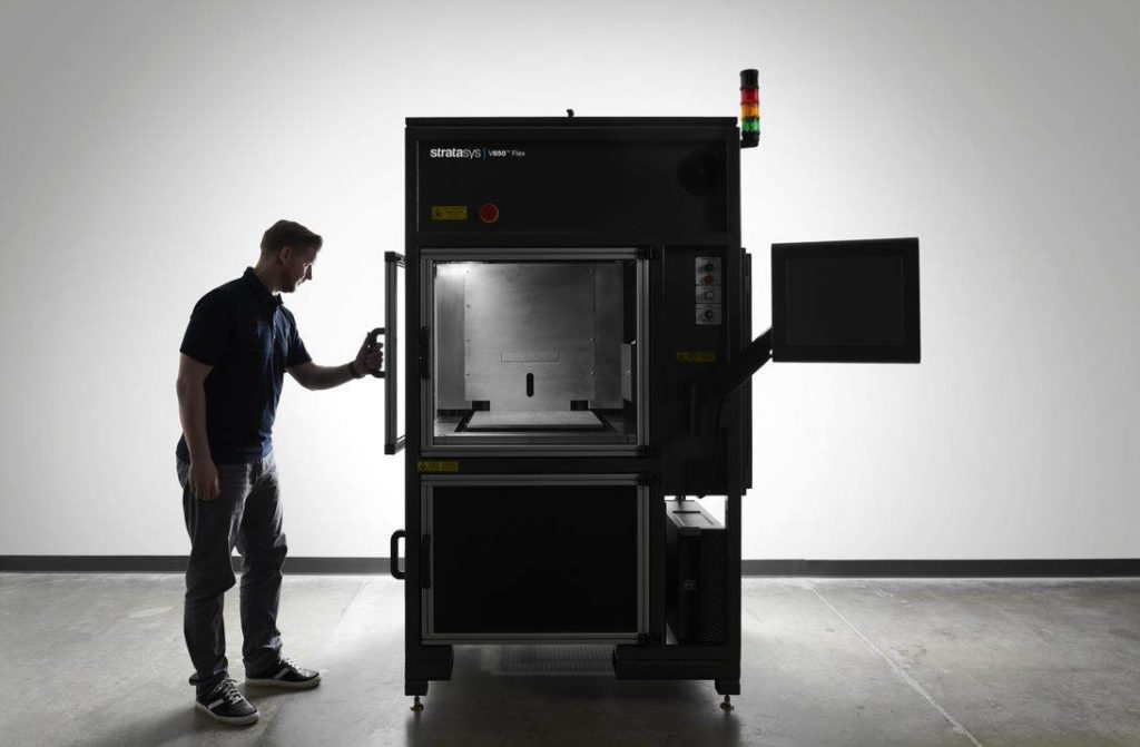 An engineer using the Stratasys V650 3D printing system.