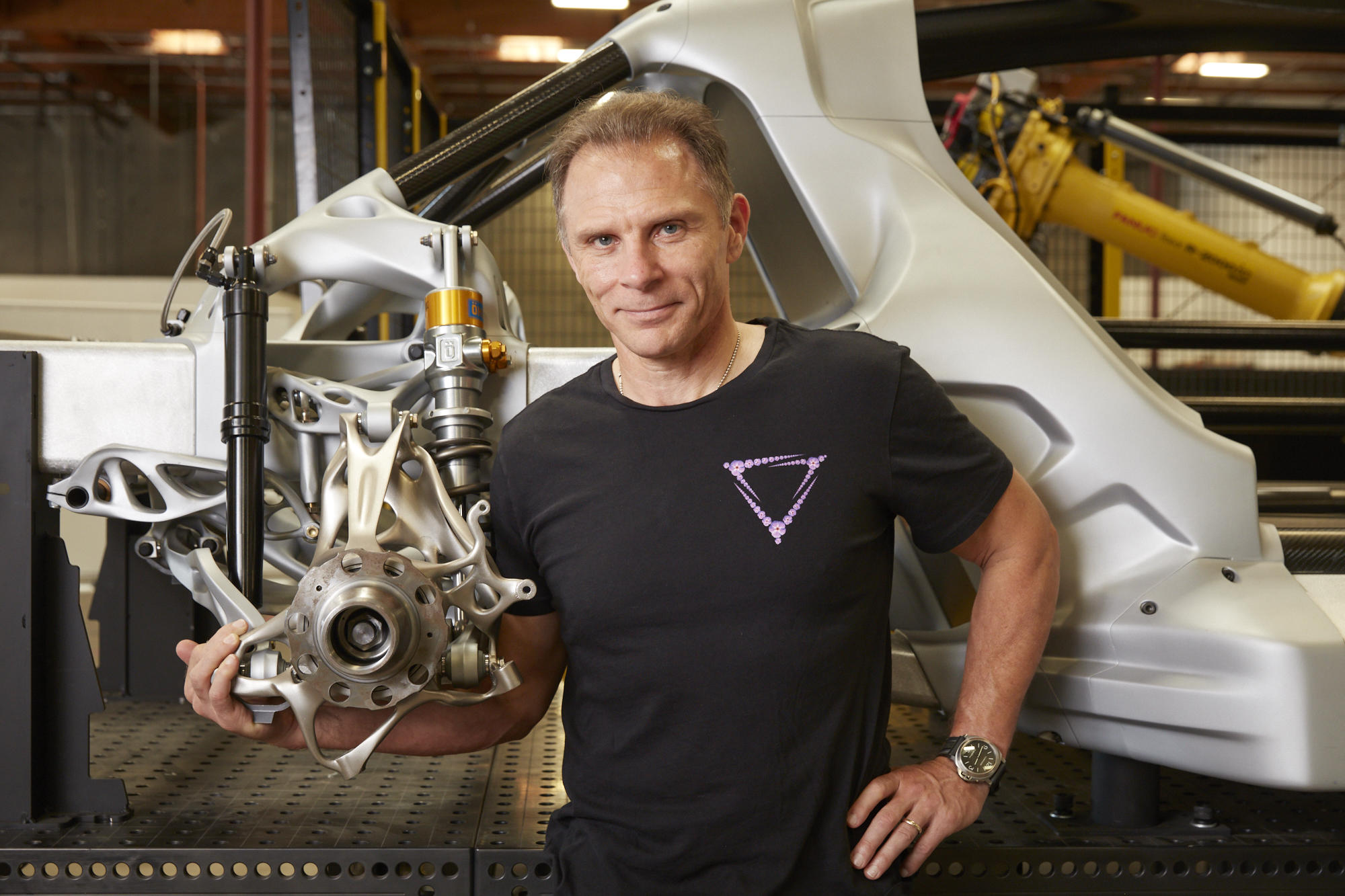 Divergent Technologies founder and CEO Kevin Czinger with an additively manufactured component for the Czinger hypercar