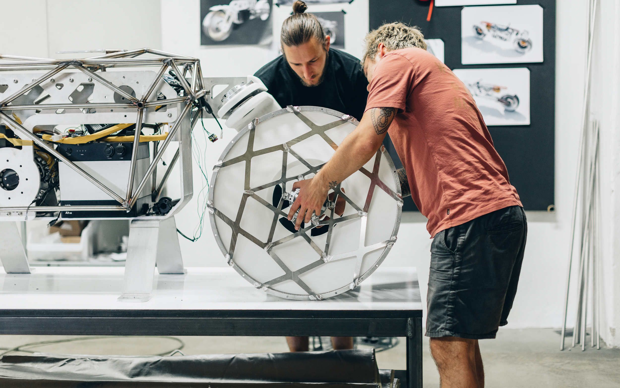 Nico Müller and his team install the 3D printed airless tire for the lunar motorcycle concept Tardigrade.