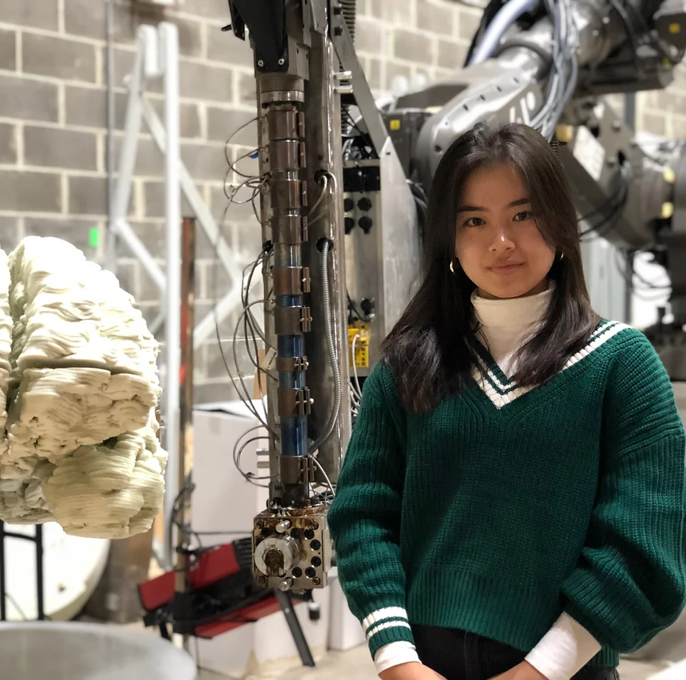 High school student Elena Malott next to her large 3D printed brain.
