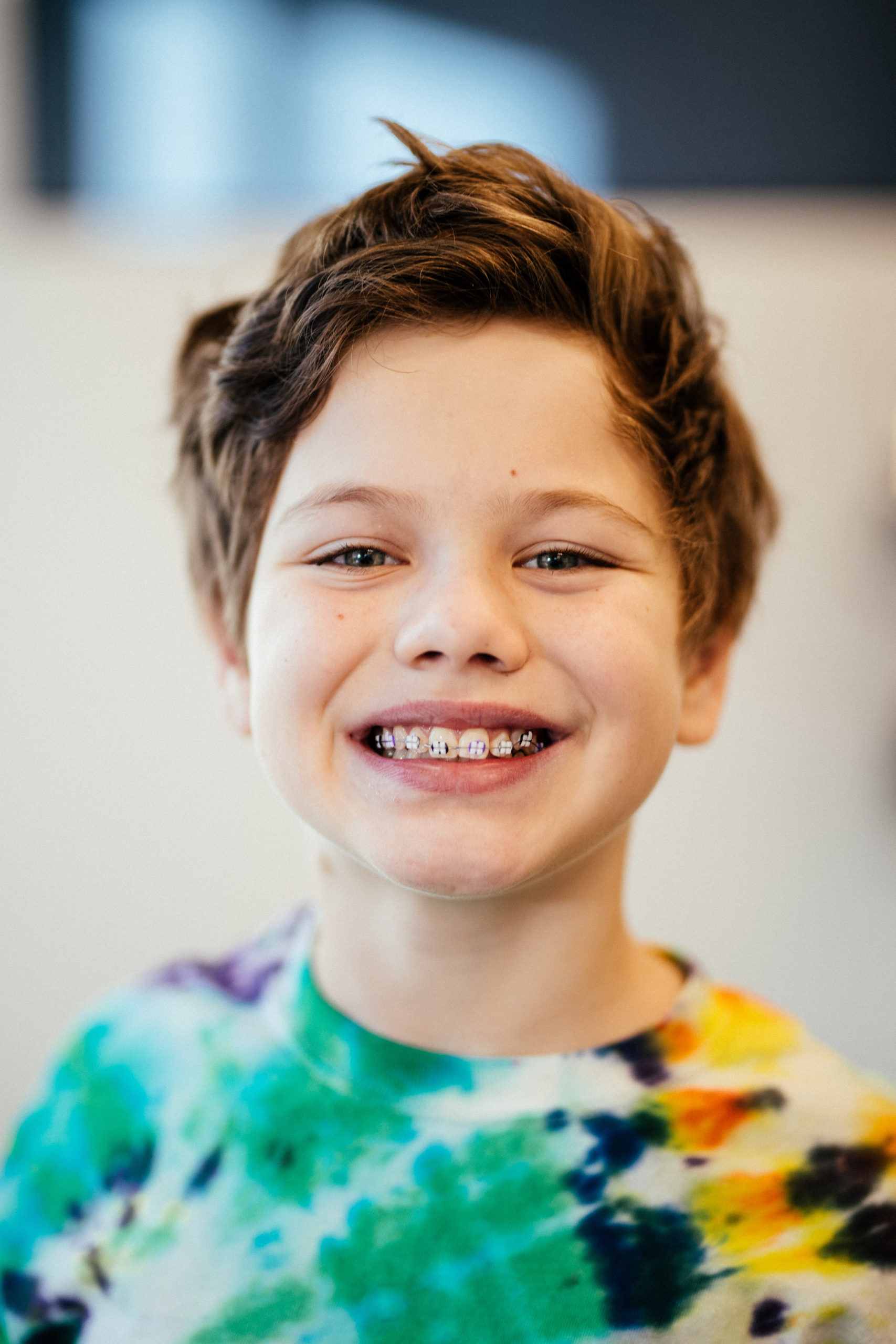 Child wearing LightForce Orthodontics' new translucent braces