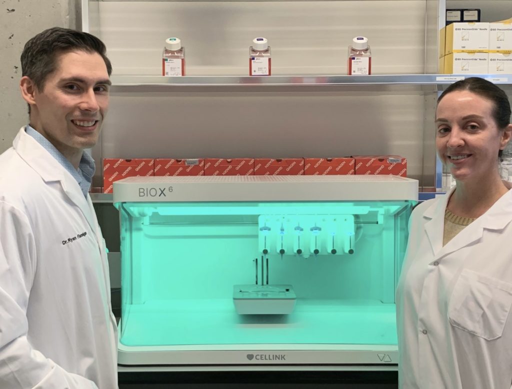 Dr. Ryan Flannigan and research assistant Meghan Robinson with bioprinter.