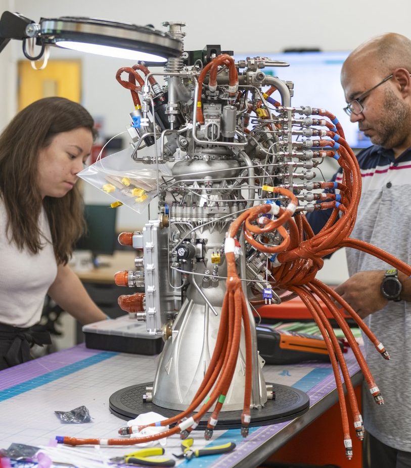 Turbo design engineer Stephanie Gavell (L) and build operations manager Chaka Smith (R) assembling one of Ursa Major's Hadley engines. 