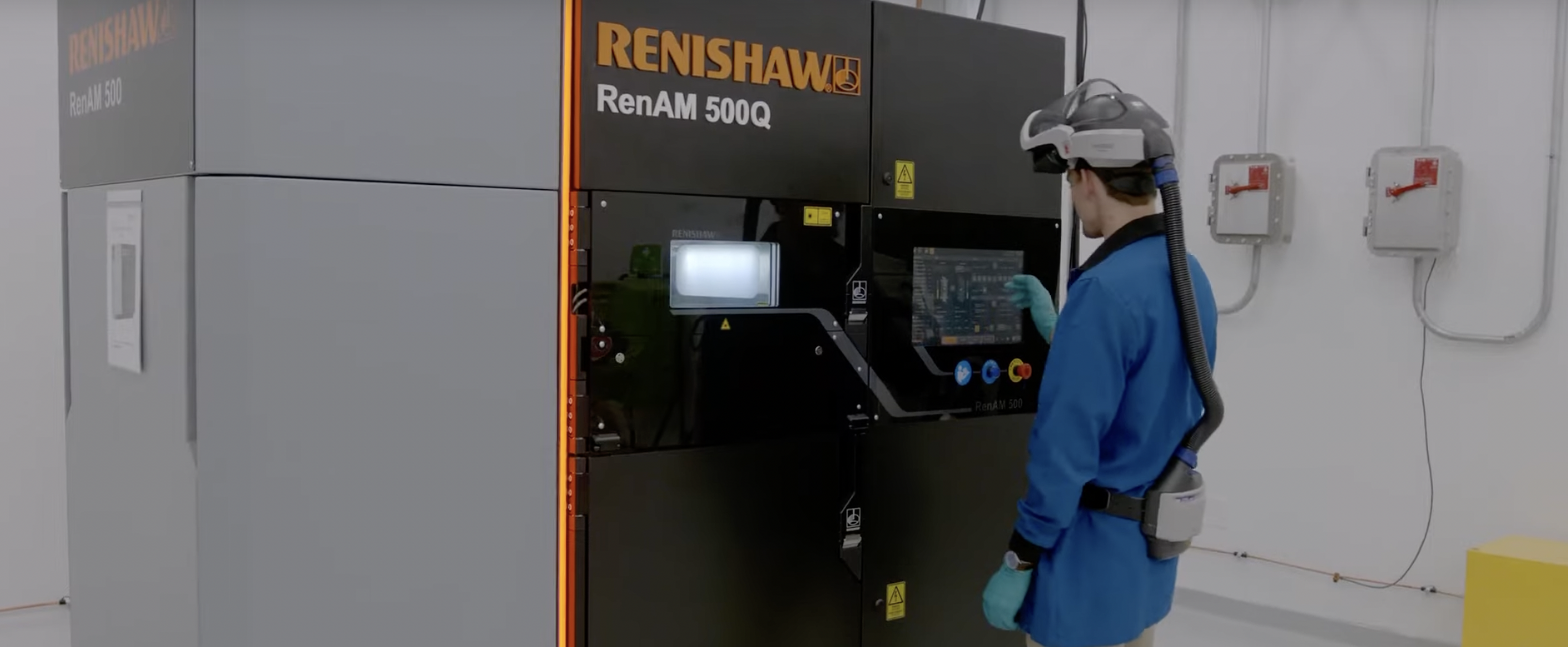 An engineer at one of Collins Aerospace facilities using a Renishaw 3D printer.
